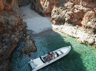 Secret Beaches & Caves Private Boat Trip from Kolymvari